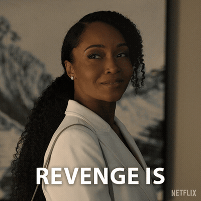 A Woman In A White Jacket Is Standing Next To A Sign That Says " Revenge Is " GIF