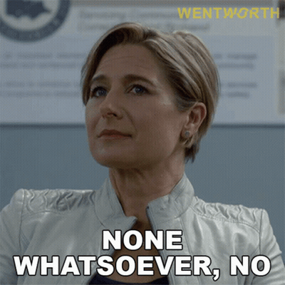 A Woman In A White Jacket Says " None Whatsoever, No " GIF