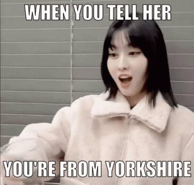 A Woman In A White Jacket With A Meme That Says When You Tell Her You 'Re From Yorkshire GIF