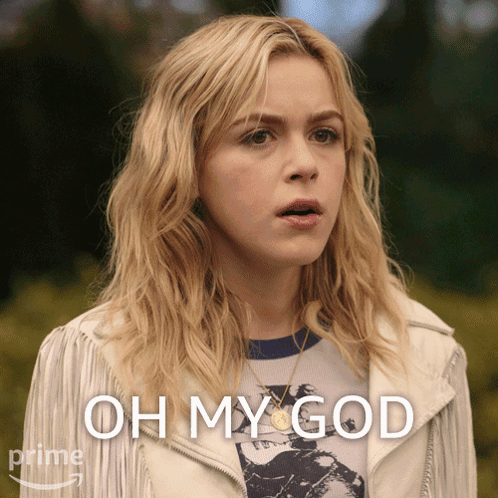 A Woman In A White Jacket With The Words Oh My God Behind Her GIF