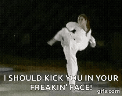 A Woman In A White Karate Uniform Is Kicking A Man In The Face . GIF