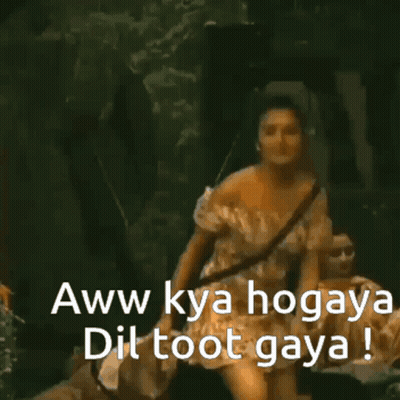 A Woman In A White Off The Shoulder Dress Says " Aww Kya Hogaya Dil Toot Gaya " GIF