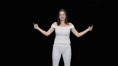 A Woman In A White Off The Shoulder Top And White Jeans Is Dancing GIF