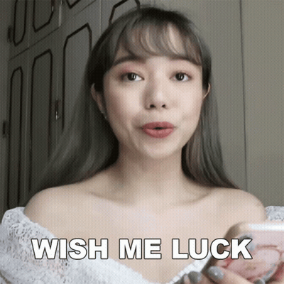 A Woman In A White Off The Shoulder Top Is Holding A Blush And Says Wish Me Luck GIF