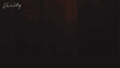 A Woman In A White Robe With The Word Verity On The Bottom Right GIF