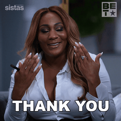 A Woman In A White Shirt Is Giving A Thank You Sign GIF