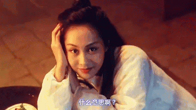 A Woman In A White Shirt Is Laying Down With Her Hand On Her Forehead . GIF
