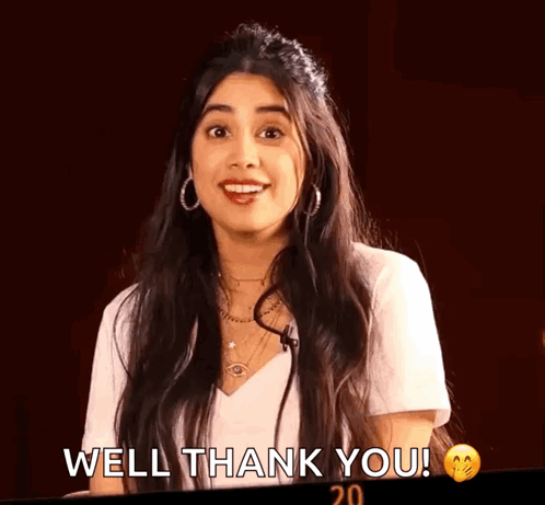 A Woman In A White Shirt Is Smiling And Saying Well Thank You . GIF