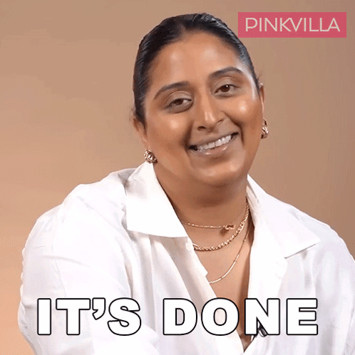 A Woman In A White Shirt Is Smiling With The Words It 'S Done Behind Her GIF