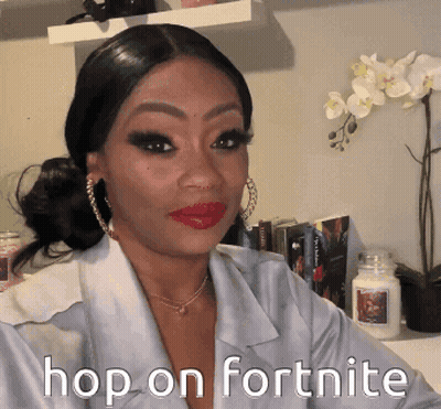 A Woman In A White Shirt Says Hop On Fortnite On Her Face GIF