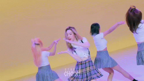 A Woman In A White Shirt With The Word Chanel On The Shoulder GIF