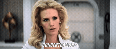 A Woman In A White Shirt With The Word Concentration Written Below Her GIF