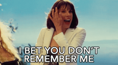 A Woman In A White Suit Says I Bet You Don 'T Remember Me GIF
