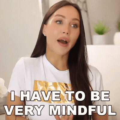 A Woman In A White T-Shirt Is Saying I Have To Be Very Mindful GIF