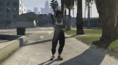 A Woman In A White Tank Top And Black Pants Is Standing On A Sidewalk GIF