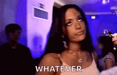 A Woman In A White Tank Top Is Standing In A Room With A Blue Light And Says Whatever . GIF