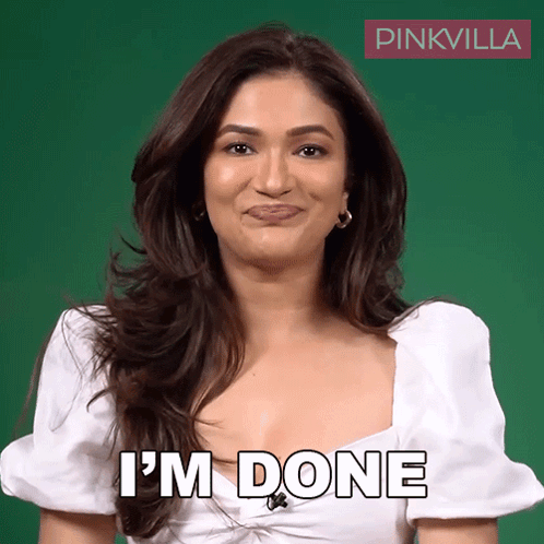 A Woman In A White Top Says I 'M Done In Front Of A Green Background GIF