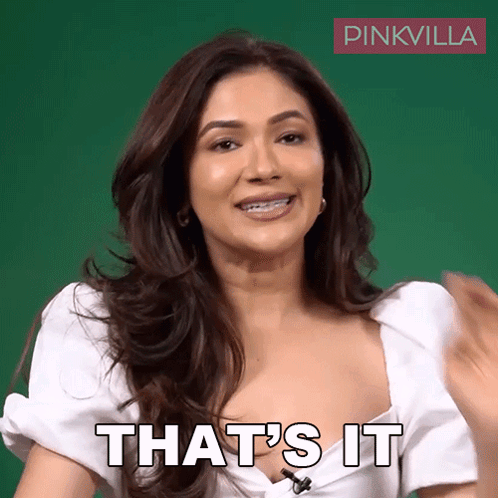 A Woman In A White Top Says That 'S It In Front Of A Green Background GIF