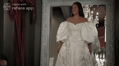 A Woman In A White Wedding Dress Is Standing In Front Of A Mirror With The Words Made With Reface App On The Bottom GIF