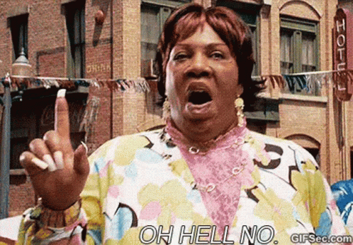 A Woman In A Wig Is Making A Funny Face While Pointing Her Finger At The Camera . GIF