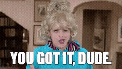 A Woman In A Wig Says You Got It Dude In A Living Room GIF
