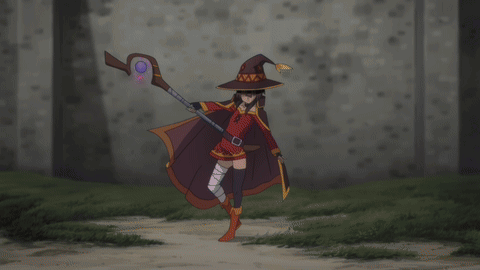 A Woman In A Witch Costume Is Holding A Wand GIF