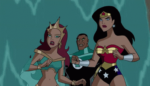 A Woman In A Wonder Woman Costume Is Standing Next To Another Woman In A Blue Dress GIF