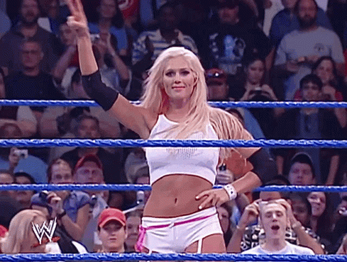 A Woman In A Wrestling Ring Giving A Thumbs Up Sign GIF