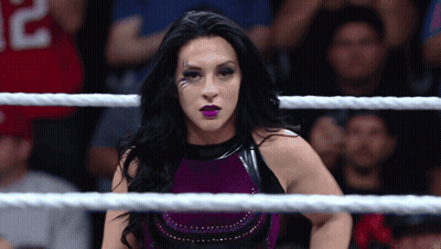 A Woman In A Wrestling Ring With A Jersey That Says 32 On It GIF