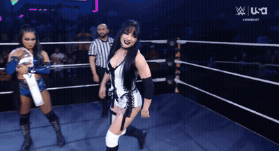 A Woman In A Wrestling Ring With A Usa Logo On The Bottom GIF