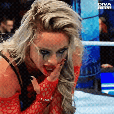 A Woman In A Wrestling Ring With Diva Bible On The Bottom GIF