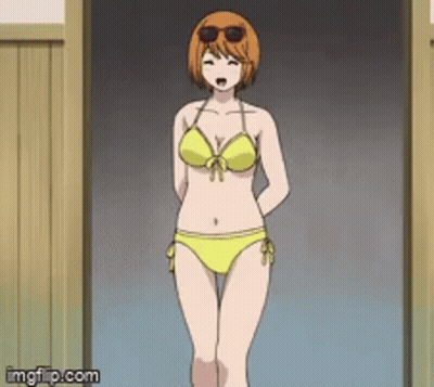 A Woman In A Yellow Bikini And Sunglasses Stands In A Doorway . GIF