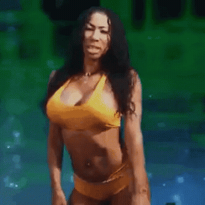 A Woman In A Yellow Bikini Is Standing With Her Arms Crossed In A Pool . GIF