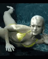 A Woman In A Yellow Bikini Is Swimming In The Water Sticker