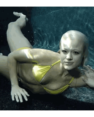 A Woman In A Yellow Bikini Is Underwater Sticker