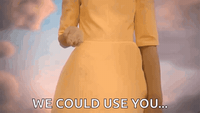 A Woman In A Yellow Dress Is Holding Out Her Hand And Says We Could Use You GIF