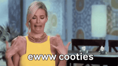 A Woman In A Yellow Dress Is Making A Funny Face While Holding Her Breasts And Says Ewww Cooties . GIF