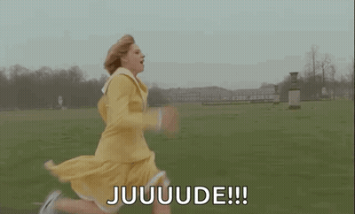 A Woman In A Yellow Dress Is Running In A Field And Saying Juuuuuude . GIF
