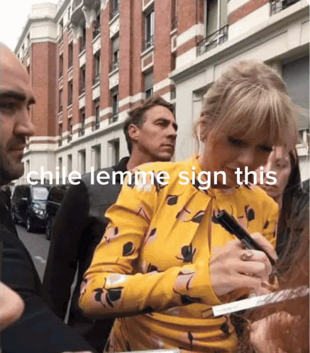 A Woman In A Yellow Dress Is Signing A Piece Of Paper With The Words Chile Lemme Sign This Above Her GIF