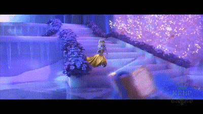 A Woman In A Yellow Dress Is Walking Down A Set Of Stairs In A Purple Room . GIF