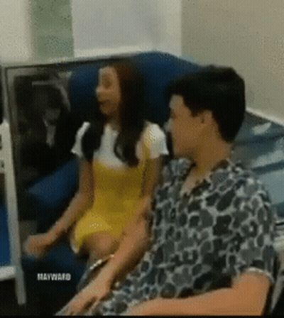 A Woman In A Yellow Dress Sits Next To A Man In A Leopard Print Shirt With Maywafd Written On The Bottom GIF
