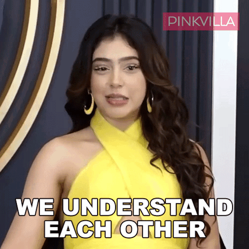 A Woman In A Yellow Dress With The Words We Understand Each Other Behind Her GIF