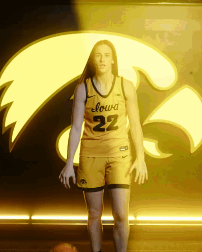 A Woman In A Yellow Iowa 22 Jersey GIF