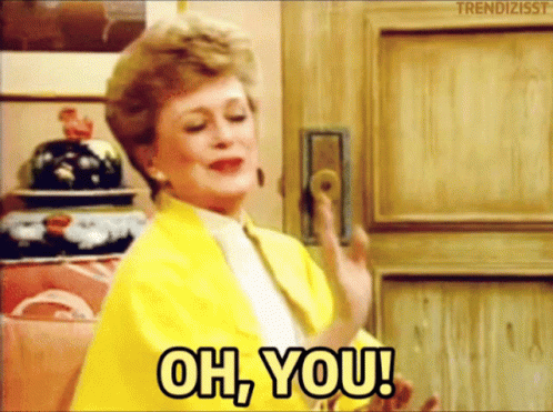 A Woman In A Yellow Jacket Is Holding A Door Handle And Saying Oh You GIF