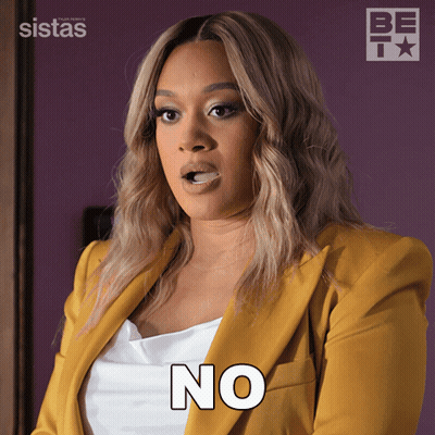 A Woman In A Yellow Jacket Says " No " GIF