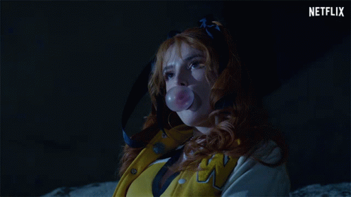 A Woman In A Yellow Jacket With The Letter W On The Front GIF