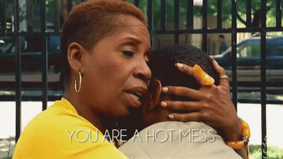 A Woman In A Yellow Shirt Is Hugging A Man With The Words " You Are A Hot Mess " On The Bottom GIF