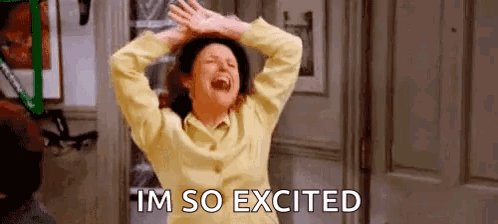 A Woman In A Yellow Shirt Is Laughing With Her Arms In The Air And The Words `` Im So Excited '' . GIF