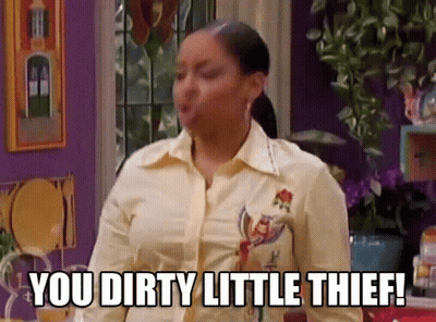 A Woman In A Yellow Shirt Is Saying You Dirty Little Thief ! GIF