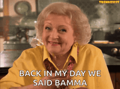 A Woman In A Yellow Shirt Is Smiling And Says Back In My Day We Said Bamma GIF